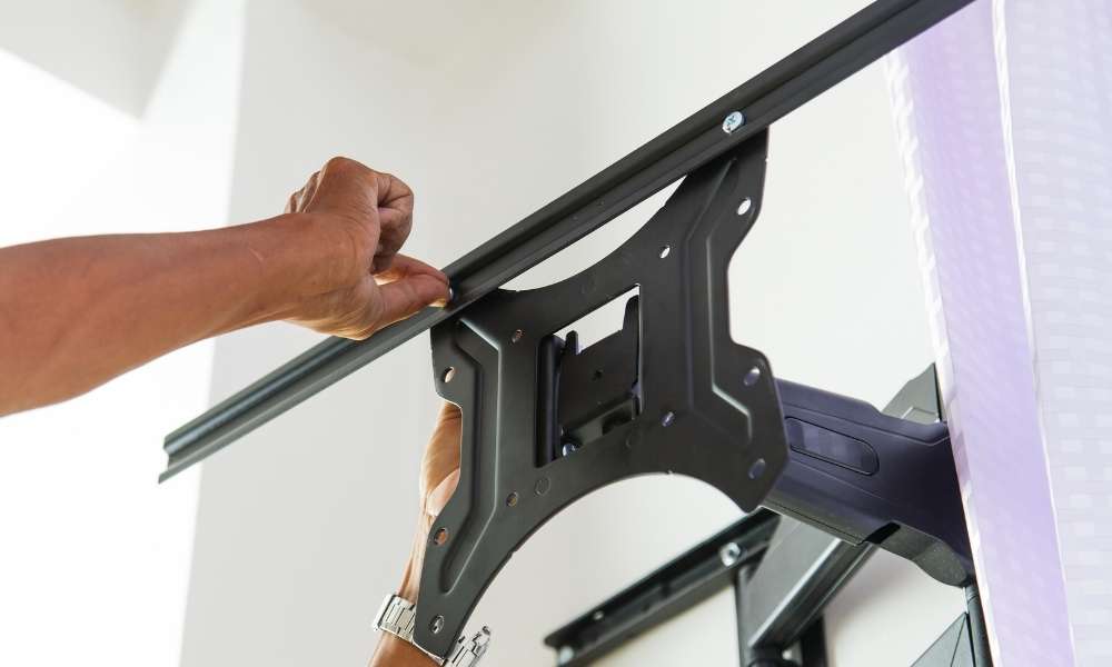 Install the mounting bracket in install bathroom light fixture
