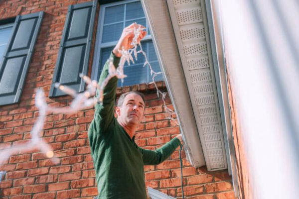 How to Hang Christmas Lights on a Flat Roof with Stucco Walls